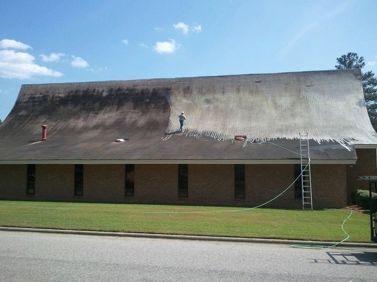 Soft washing years of grime off a large church roof
