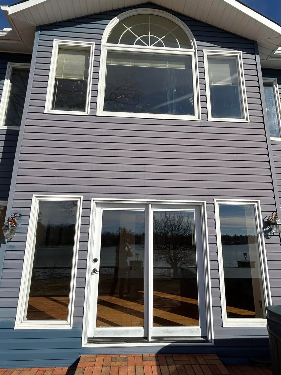 Freshly cleaned siding on a waterfront home